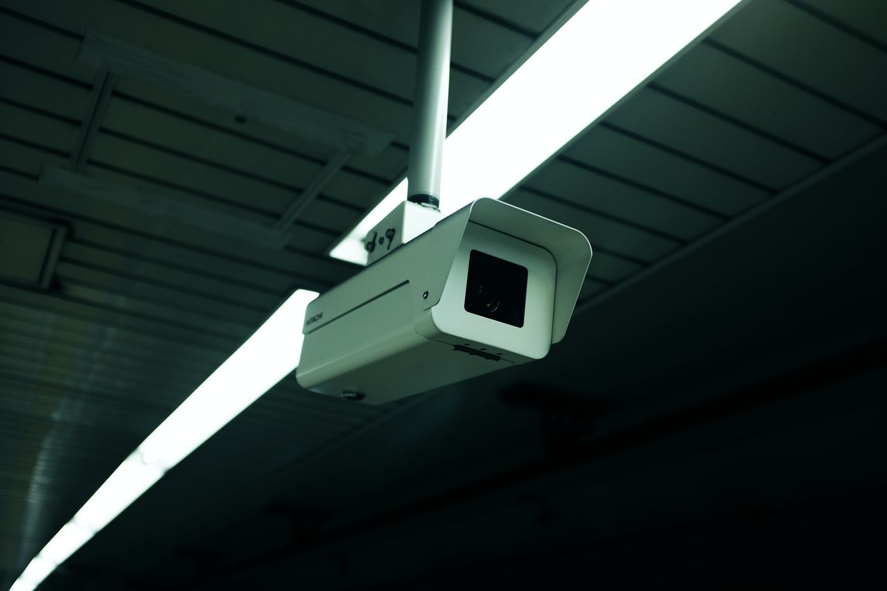 home-hero-img Close-up of an indoor ceiling-mounted security camera for surveillance applications.